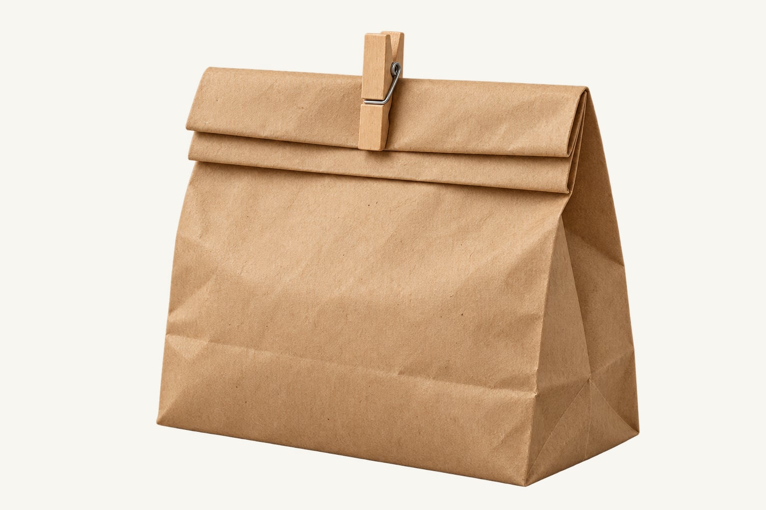 A brown paper bag with its top folded down twice and closed with a wooden clip
